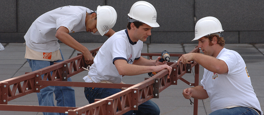 students working on steel bridge